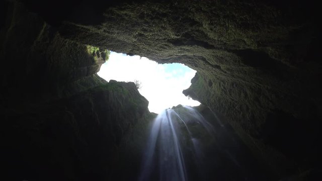 Looking toward the sky from inside mossy Gljufrabui cave waterfall Iceland.mov