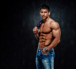 Fototapeta na wymiar Shirtless Handsome Muscular Male Model in Jeans