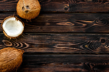 Coconut for cosmetic in body treatment concept on wooden background top view copyspace