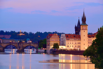 Charles Bridge and historiical buildings in Prague at night