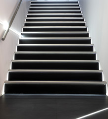 Stairs with railing leading up. Concept of movement and growth