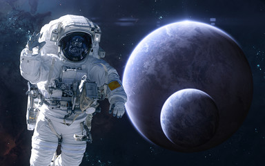Obraz na płótnie Canvas Astronaut on background of exoplanets in deep space. Science fiction. Elements of this image furnished by NASA