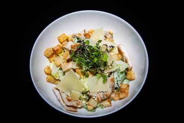 a classic take on the traditional fresh Chicken Ceaser salad with chicken, croutons and parmesan cheese 
