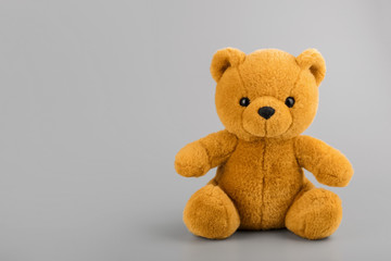 Teddy bear on grey background copyspace
