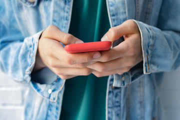 the young man's hands or student with the mobile phone