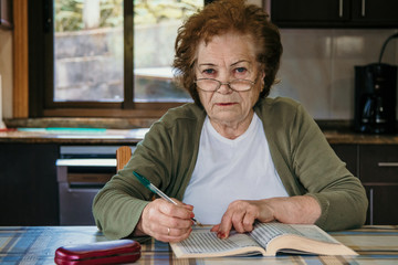 senior woman with the book or hobbies at home