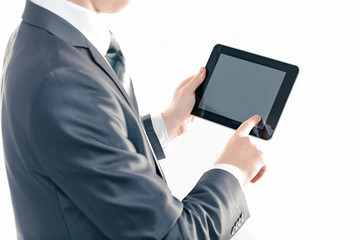 close up. businessman tapping the screen of the digital tablet