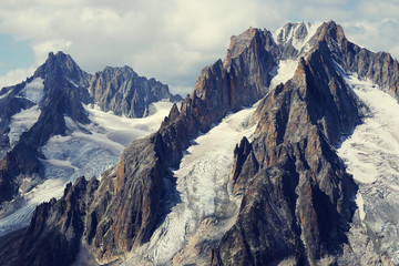 Petit Dru and a white cloud similar to a chimney and smoke, Chamonix, France