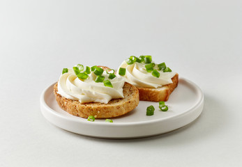 plate of toasted bread with cream cheese