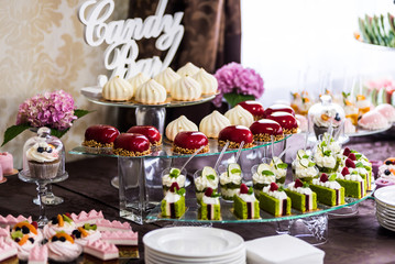 Candy bar. Candies table on the celebration party.
