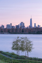 Fototapeta premium Long Island Pier at sunset and Downtown Manhattan on background,long exposure.