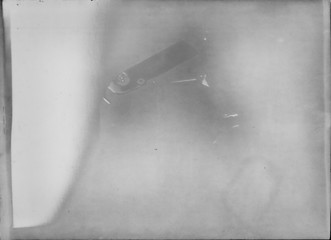 A real, black and white large-format spoiled photo with dust and scratches. Glass photographic...