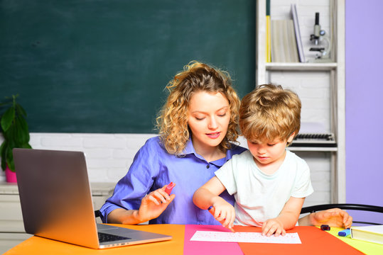 Learning and education concept. Mother and son schooling together. Cute pupil and his mother learning. Nice family photo of little boy and his mom. Back to school. Family day. Education. September 1.