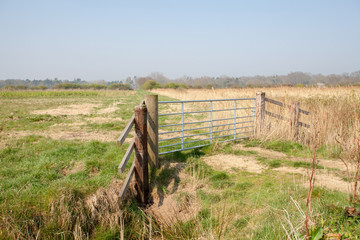 Farmland gate. Country walk along rural Norfolk Broads farm land