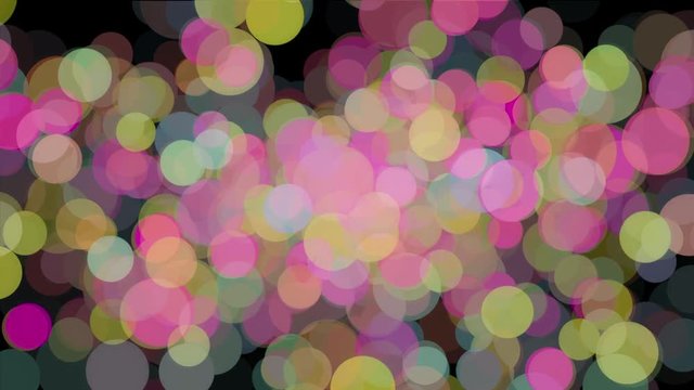 Abstract animation of many colored particles of bubbles floating chaotically and blinking on the black background. Animation. Fireflies and bokeh effect to use as a screensaver or as a mask