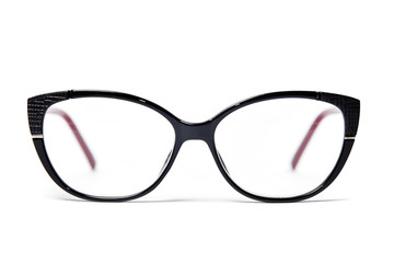 Fototapeta premium Plastic glasses frame black color on white background close up