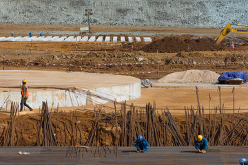 Construction workers are tying steel bars at the construction site