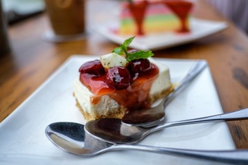 Closeup stawberry cake on white dish and the spoon