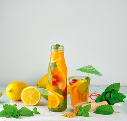 summer refreshing drink lemonade with lemons, mint leaves