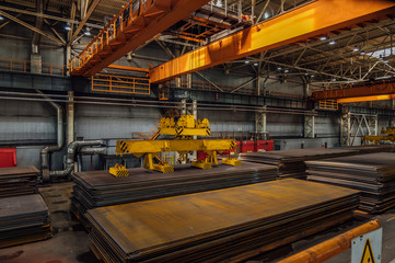 Overhead crane with electromagnetic beam