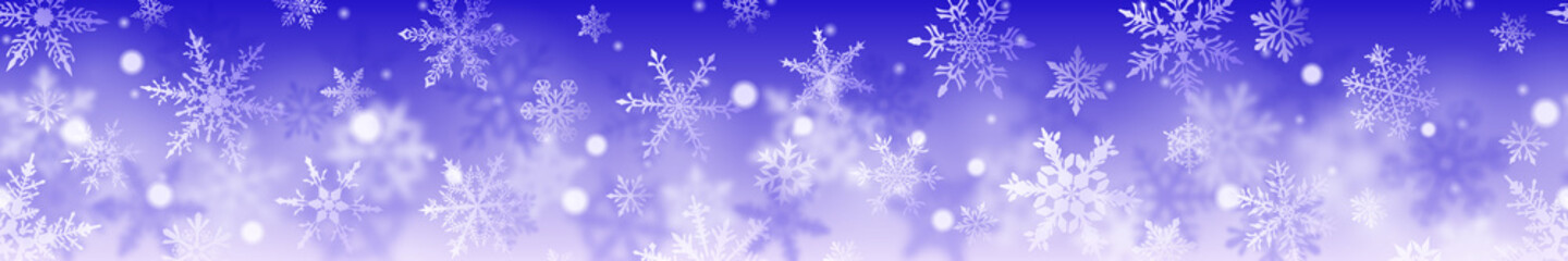 Christmas banner of complex blurred and clear snowflakes in white colors on blue background. With horizontal repetition