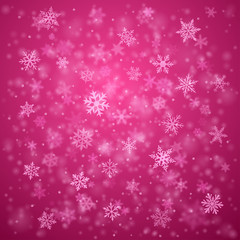 Christmas background of complex blurred and clear falling snowflakes in pink colors with bokeh effect
