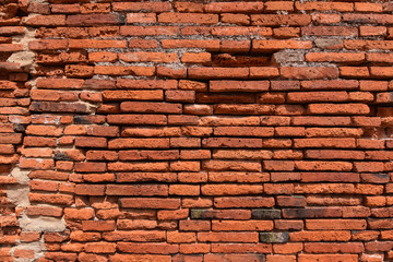 The surface of the red brick wall is damaged by the World Heritage Site, Ayutthaya, Thailand, Southeast Asia.