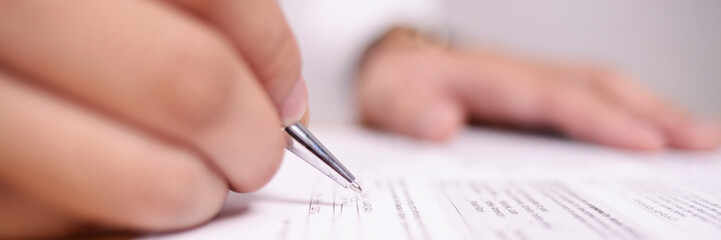 Wide View of Businessman Signing Contract