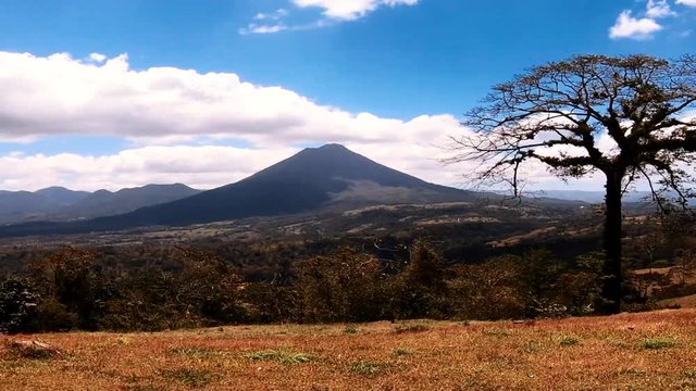 Arenal Volcano, Costa Rica, during daytime from distant pan view