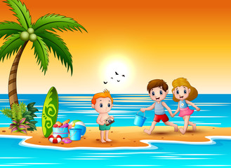 Obraz na płótnie Canvas Happy children playing at the beach