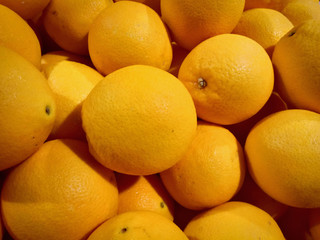 fruit Orange pile texture. Fresh Orange on market. Vitamin healthy food spice image.Orange top view