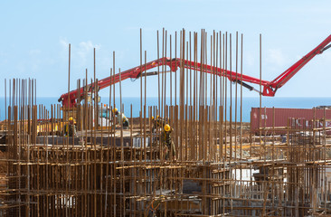 building under construction  concrete pump truck