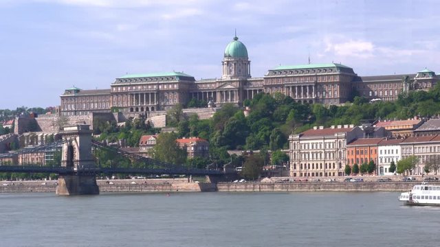 Budapest Danube river with the castle in the background a turist boat passing by