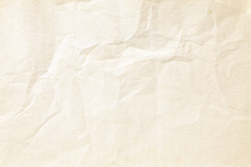 Old pale brown crumpled paper background texture
