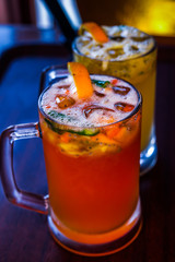 glass of juice with ice and lemon