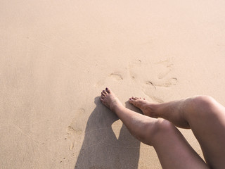 woman selfie barefoot sunbathing on sunset summer beach