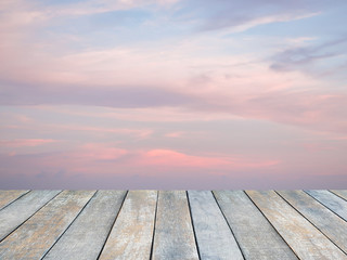 Wood table top over twilight drametic sunset sky