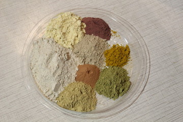 Mixture of different powders. Different colors, on one plate