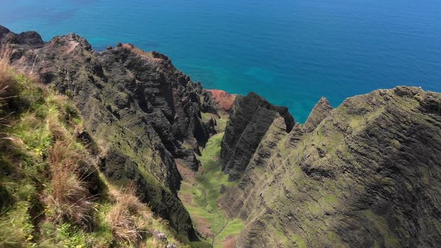 Version One. Aerial Drone Descending into the Na Pali Coast Mountains and Kalalau Valley in Hawaii.
