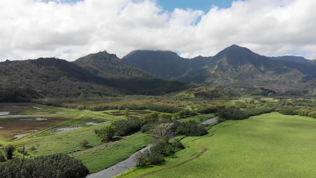 Aerial Dolly Movement over Princeville and the Floodplain in Hawaii with Stunning Panoramic Views.