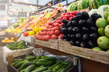 Vegetable farmer market counter: colorful various fresh organic healthy vegetables at grocery store. Healthy natural food concept