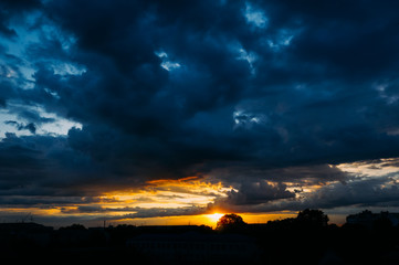 Natural Sunset Sunrise. Bright Dramatic Sky And Dark Ground. Colorful Sky At Sunset Dawn Sunrise. Sun Over Skyline, Horizon.