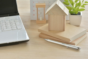 Wooden house and a computer   