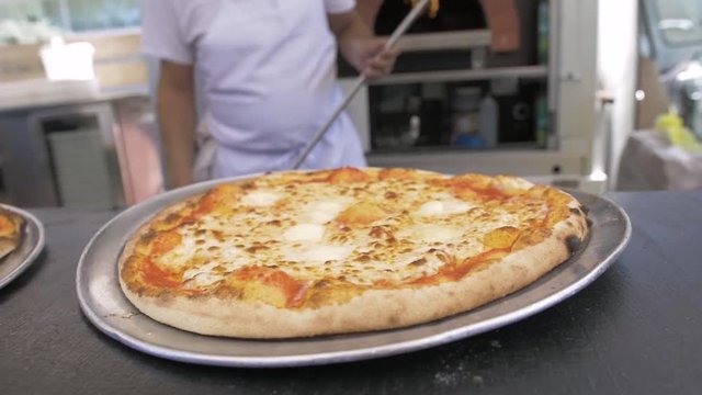 Hot margherita pizza fresh out of the oven.