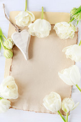 Obraz na płótnie Canvas White tulips on paper background