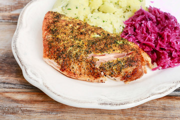 Simple dinner with fish (salmon), potatoes and vegetable salad