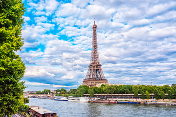 Fototapeta na wymiar View of Eiffel Tower from the Seine river in Paris at summer evening, France