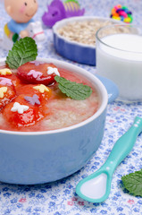 Oatmeal for baby feeding with plum jam