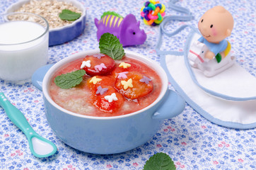 Oatmeal for baby feeding with plum jam