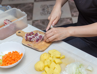 minced meat in the kitchen with a knife on a cutting board